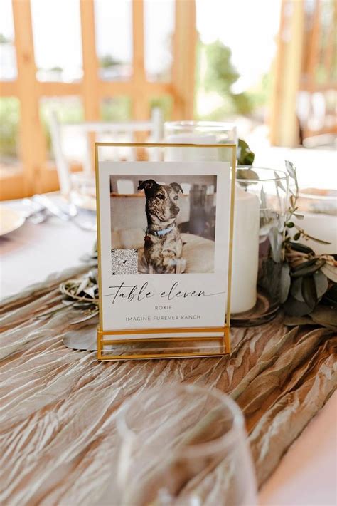 A Table Topped With A Card Next To A Candle