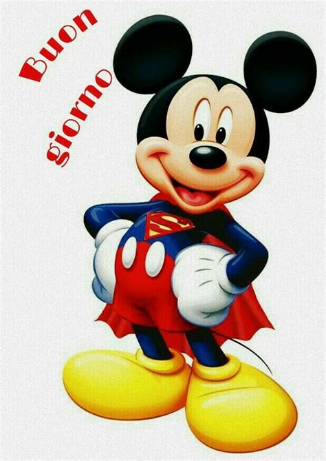 The Mickey Mouse Is Wearing A Red Cape And Standing In Front Of A White