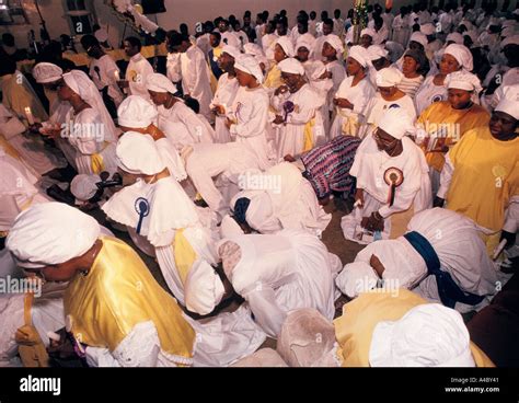 Members of the Celestial Church Of Christ pray during the harvest ...