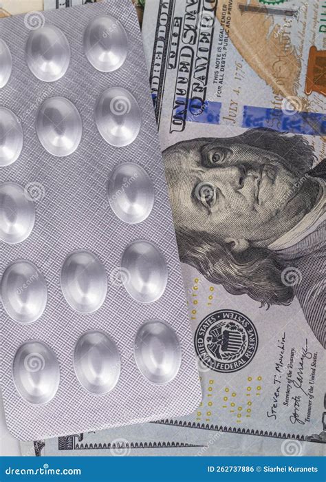 Us Dollars With Pills Tablets Packed In Foil The Concept Of Health