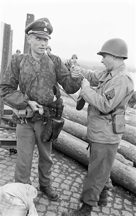 A Waffen Ss Officer Surrenders To A Us Army Sergeant On The West Side