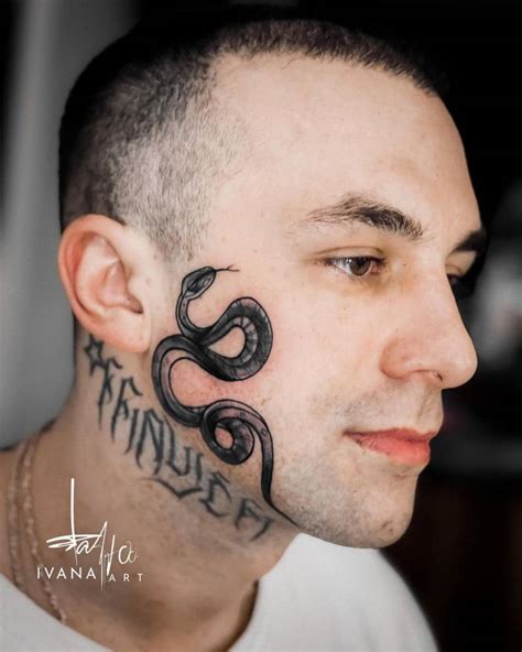 Snake tattoo located on Frayer Flexking's face.