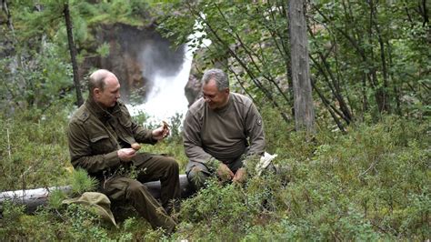 Vladimir Putin boats, sunbathes and picks mushrooms in his Russian vacation photos | CNN Politics