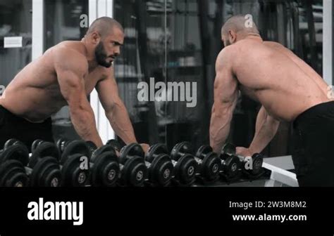 Male Bodybuilder Lifting Heavy Dumbbells At Gym Muscular Man In Naked