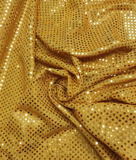 A Gold Fabric With Small Dots On It