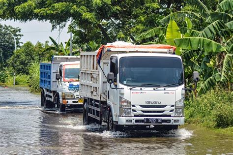 Dump truck crashing through floodwater in Gresik Regency, Indonesia, 21 ...