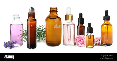 Set Of Different Essential Oils Used In Aromatherapy On White