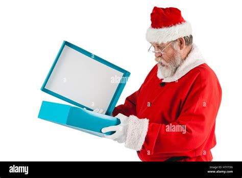 Santa Claus Opening A Gift Box Stock Photo Alamy