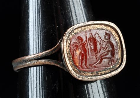 At Auction Roman Intaglio Winged Nude Cupid Nude Satyr In Copper Ring