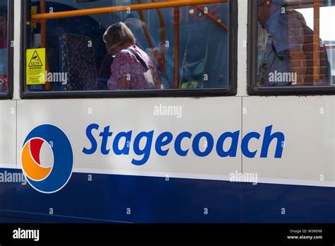 Stagecoach logo and passengers reflection on bus, tenterden, kent, uk ...