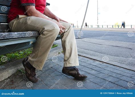 Man Sitting Or Patiently Waiting On The Bench Stock Photo Image Of