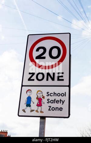 20 mph School zone speed limit sign Stock Photo - Alamy