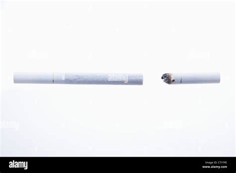 A long cigarette and a short cigarettes Stock Photo - Alamy