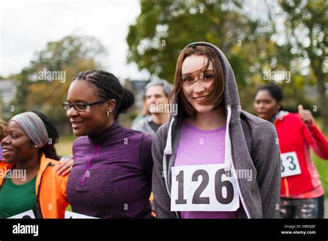 Portrait Smiling Female Runner At Charity Run In Park Stock Photo Alamy