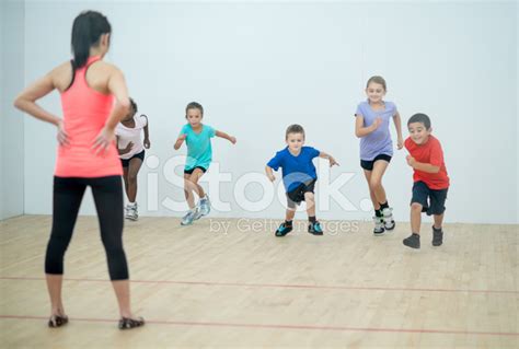 Kids Running In Gym Class Stock Photo Royalty Free Freeimages