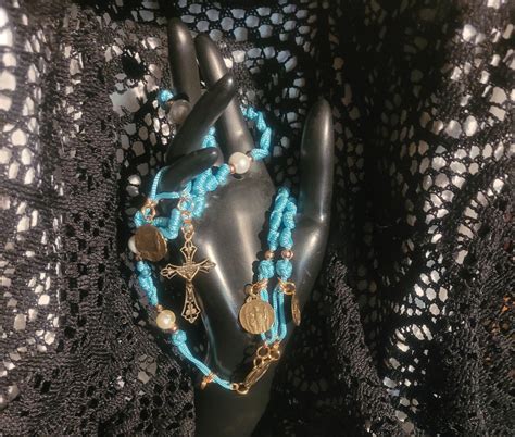 E Our Lady Of Guadeloupe And St Joan Of Arc Turquoise Paracord Rosary