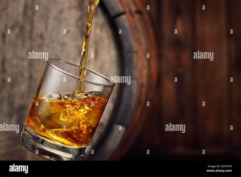 Whiskey Pouring Into Glass Stock Photo Alamy