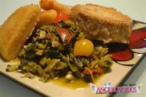 Fried boiled dumplings with coco (taro root) and callaloo (amaranth ...