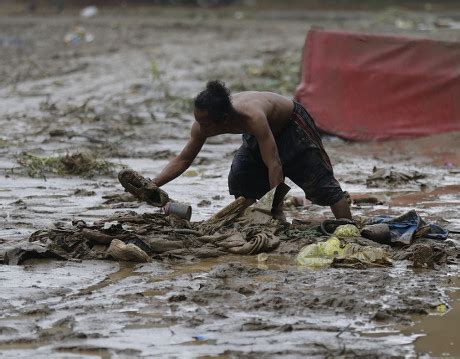 Filipino Flood Victims Maneuver Along Street Editorial Stock Photo