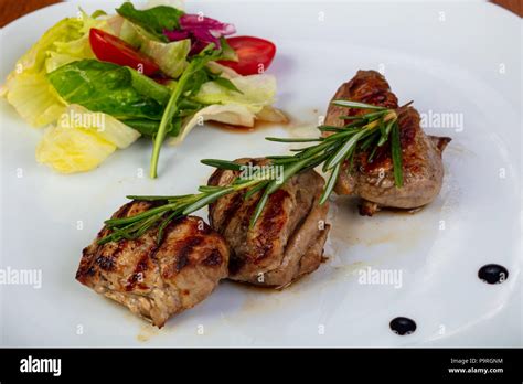 Delicious beef medallions with salad Stock Photo - Alamy