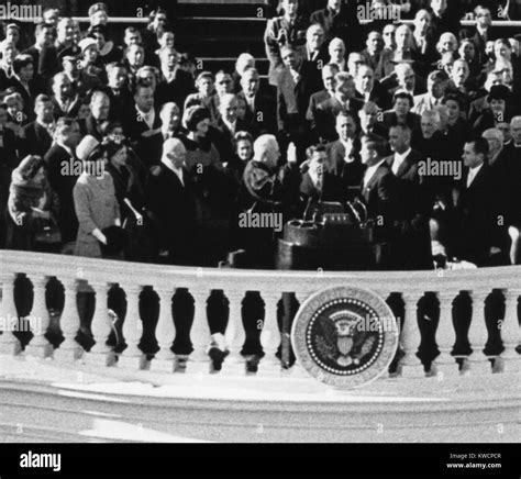 President John Kennedy Takes The Oath Of Office Administered By Chief