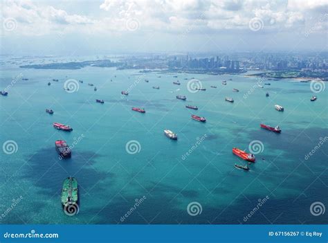 Cargo Container Ships Lined Up To Enter The Port Of Singapore Editorial