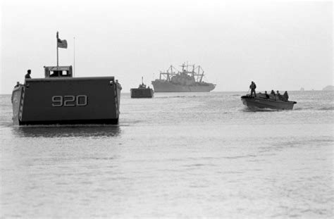 Two LCM 8 Mechanized Landing Craft Head For Shore To Pick Up Marine