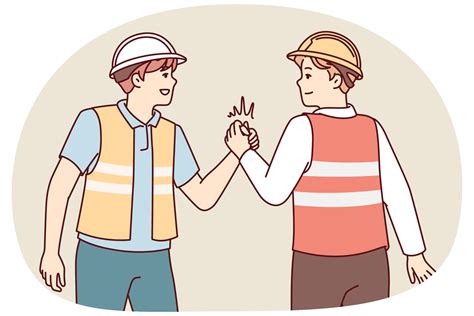 Two Men In Uniform Of Builders Shake Hands Holding Each Others Palms