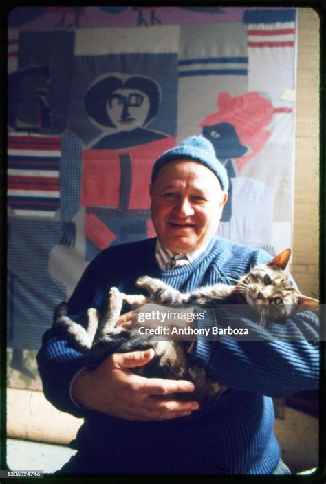 Portrait Of American Artist Romare Bearden As He Poses With His Cat