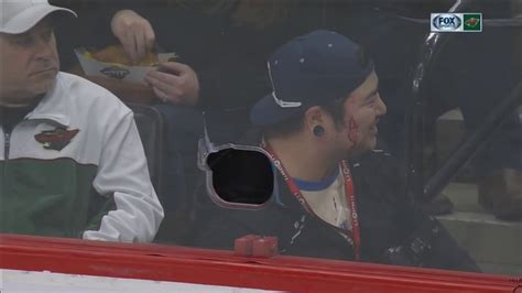 Wild Player Shoots Puck Through Hole In Glass Hits Photographer Youtube