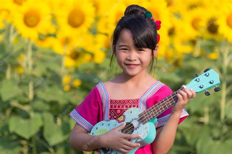 Premium Photo Beautiful Asian Girl Playing Ukulele