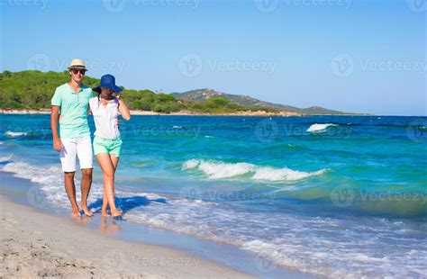 Happy family at white beach during tropical vacation 18831504 Stock Photo at Vecteezy