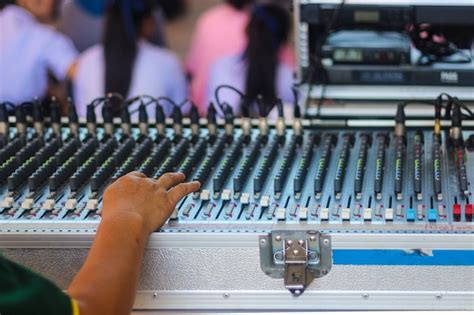 Premium Photo Close Up Of Musician Hand Adjusting Audio Equipment