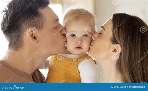 Closeup Portrait of Loving Parents Kissing Their Cute Little Baby at ...