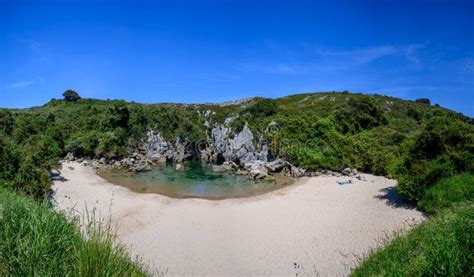 Playa De Gulpiyuri Flooded Sinkhole With Inland Beach Near Llanes In