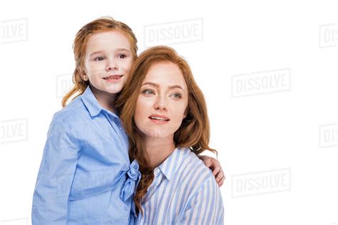 Beautiful Redhead Mother And Daughter Smiling And Looking Away Isolated