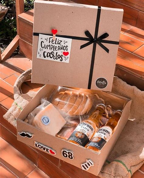 A Box That Has Some Kind Of Food Inside Of It On A Wooden Bench Outside