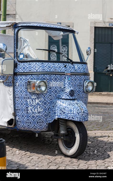 Blue Tile Patterned Piaggio Ape Tuk Tuk In Lisbon Portugal Stock Photo