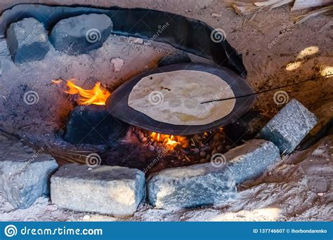 Pita Bread Cooking On Fire In A Bedouin Dwelling Stock Image Image Of