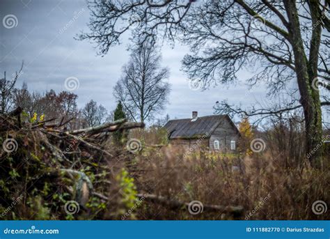 Wooden old house in forest stock photo. Image of lithuania - 111882770