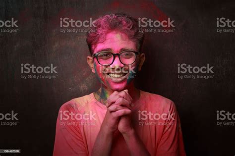 Portrait Of A Happy Smiling Boy With His Face Smeared With Colours