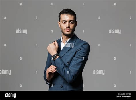 Image Of Brunette Arabic Businessman 30s In Formal Suit Looking At