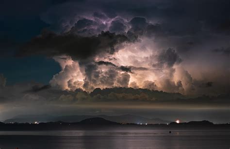 Lightning illuminates a Cumulonimbus cloud over Phuket, Thailand. : r/pics