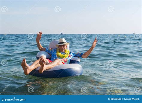 Senior Man Floating In Sea Stock Photo Image Of Chair 82523608