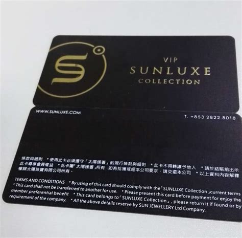 A Black And Gold Business Card With The Sunluxe Collection Logo On It