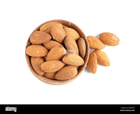 Wooden Bowl And Organic Almond Nuts On White Background Top View