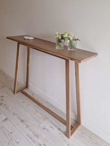 A Wooden Table With Some Flowers On It