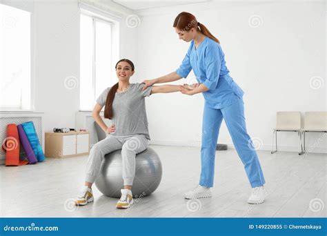 Professional Physiotherapist Working With Female Patient Stock Image