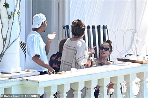 Jennifer Lopez Shows Off Her Famous Curves In A Skimpy Red Bikini While Soaking Up The Sun On