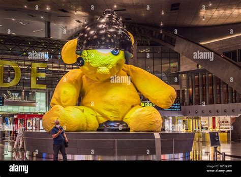 31 05 2021 Doha Qatar Yellow Lamp Teddy Bear Sculpture In The Middle Of The Terminal At The